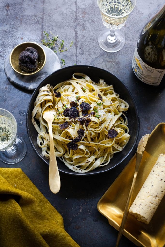 Creamy Tagliatelle with Black Truffle Butter Sauce – Luxurious pasta dish served with fresh truffles.
